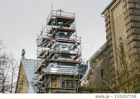 Tin roofing replacement of an old Lutheran stone church using complicated shape scaffolding 110207788