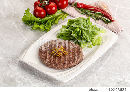 Frilled beef burger cutlet with iceberg Frilled beef burger cutlet with iceberg 110208621
