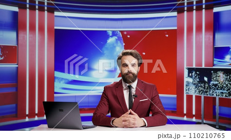 Journalist broadcasting politics news on tv program, presenting updates and commentaries on international television. Young tv broadcaster talking about world informations and scandals. 110210765