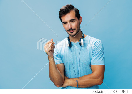 Man studio online space headphone sing music fun happy t-shirt blue lifestyle copy portrait 110211961