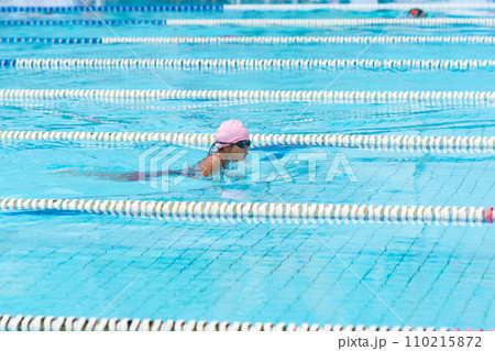 child swimmer swim in swimming pool. Water sports and competition, learning to swim classes for children. 110215872