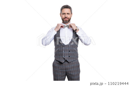 smiling man in formal tuxedo isolated on white background. formal tuxedo man in studio 110219444