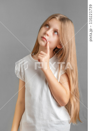 Portrait of sad little girl in white t-shirt Portrait of sad little girl in white t-shirt 110221739