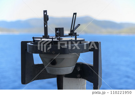Azimuth ring on gyro compass. Direction finder on the navigational bridge. Azimuth vane. Bearing finder. Navigational equipment. 110221950