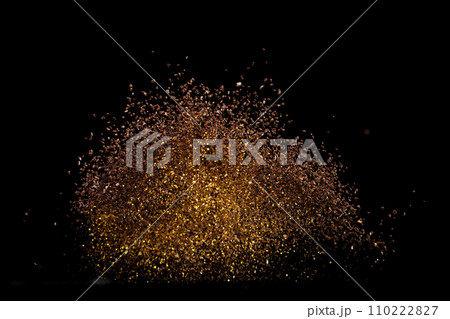 Ground Coffee roasted powder dust fly explosion, Coffee crushed ground float pouring. Roasted Coffee powder ground dust splash explosion in mid Air. Black background Isolated gold bokeh Ground Coffee roasted powder dust fly explosion, Coffee crushed ground float pouring. Roasted Coffee powder ground dust splash explosion in mid Air. Black background Isolated gold bokeh 110222827