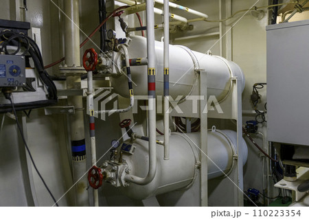 Air cylinders on ship. Engine room interior on big vessel. 110223354
