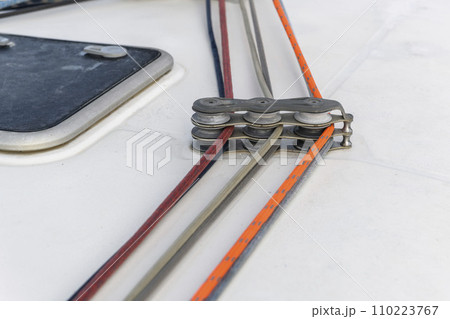 Yacht rollers with three ropes on sailing boat. Yachting concept. Yacht rollers with three ropes on sailing boat. Yachting concept. 110223767