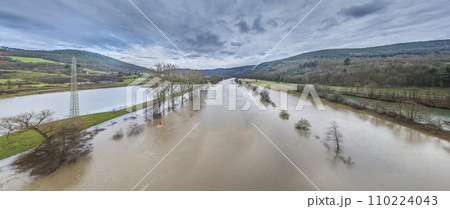 Drone image of the German river Main during a flood with flooded trees on the banks 110224043