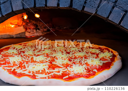 Pizza. Homemade pizza. Delicious pizza. Freshly made Italian margherita pizza with buffalo mozzarella and basil. Pizza with cheese, tomato sauce. Wood oven. World Pizza Day. February 9. 2024. Pizza. Homemade pizza. Delicious pizza. Freshly made Italian margherita pizza with buffalo mozzarella and basil. Pizza with cheese, tomato sauce. Wood oven. World Pizza Day. February 9. 2024. 110226136