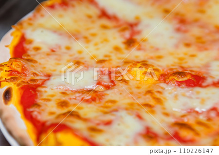 Pizza. Homemade pizza. Delicious pizza. Freshly made Italian margherita pizza with buffalo mozzarella and basil. Pizza with cheese, tomato sauce. Wood oven. World Pizza Day. February 9. 2024. 110226147