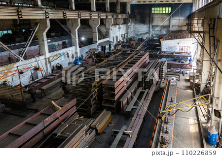 Various metal structures cut in the workshop. The factory produces metal parts, elements, and structures. Plant for the production of metal structures. Various metal structures cut in the workshop. The factory produces metal parts, elements, and structures. Plant for the production of metal structures. 110226859