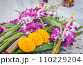 Buddhist religious offerings. Marigold, orchid, candle and incense stick, in thailand temple 110229204