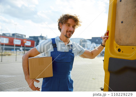 Courier closing delivery van after shipment inspecting before transportation Courier closing delivery van after shipment inspecting before transportation 110229229