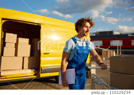 Courier delivering personal customer stuff in cardboard boxes 110229234