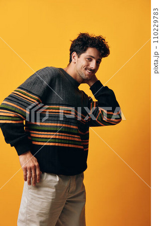 Style man happy smile yellow fashion background orange student portrait trendy sweater stylish Style man happy smile yellow fashion background orange student portrait trendy sweater stylish 110229783