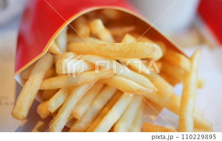 french fries in red carton pack 110229895