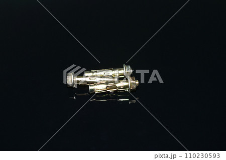 Three anchor bolts on a black background. Three anchor bolts on a black background. 110230593
