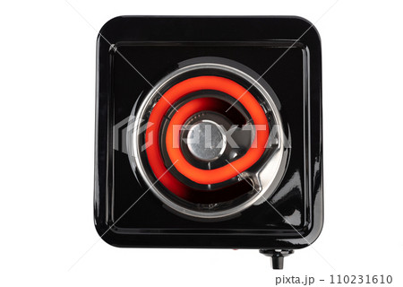 Top view of a tabletop electric stove with a hot heating element. 110231610