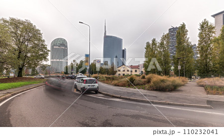 Panorama showing skyscrapers and towers from park with green lawn timelapse in Milan Panorama showing skyscrapers and towers from park with green lawn timelapse in Milan 110232041
