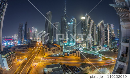 Aerial view of Dubai Downtown skyline with many towers night timelapse. Aerial view of Dubai Downtown skyline with many towers night timelapse. 110232089