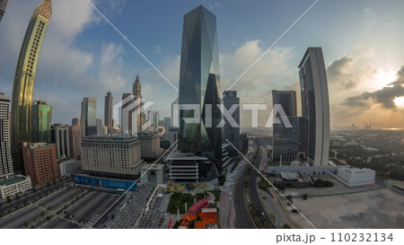Panorama of Dubai International Financial district aerial night to day timelapse. View of business office towers. 110232134