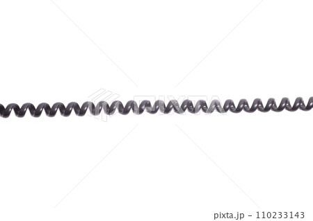 Black spiral telephone cord isolated on white background. Black spiral telephone cord isolated on white background. 110233143