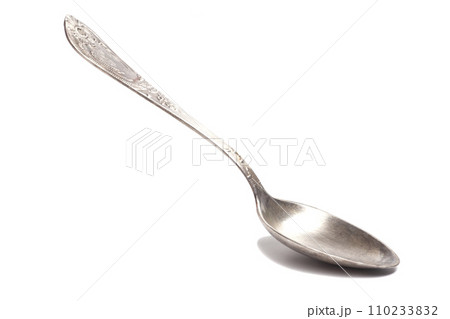 Old silver teaspoon with handle pattern isolated on white background 110233832