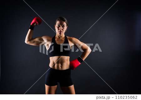 MMA female in sports uniform ready to fight, defense of women from violence MMA female in sports uniform ready to fight, defense of women from violence 110235062