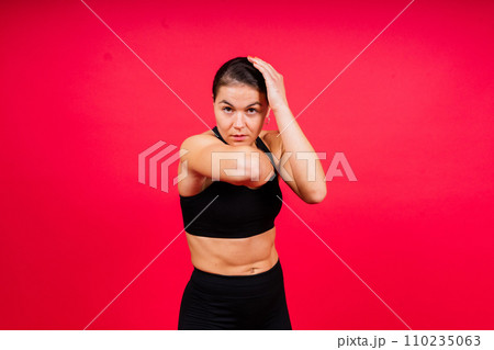 MMA female in sports uniform ready to fight, defense of women from violence 110235063