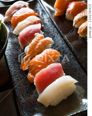 Nigiri sushi on black plate. Japanese food. Nigiri sushi on black plate. Japanese food. 110236415