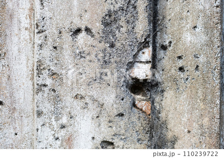 Detail of eroded building wall. Ancient damaged wall. 110239722