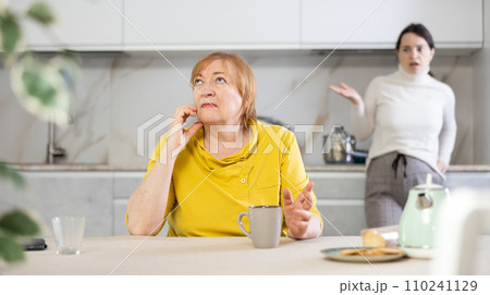 Frustrated mature woman after a conflict with her daughter 110241129