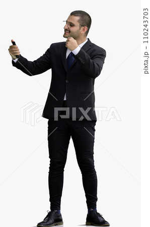 man in full growth. isolated on white background using phone man in full growth. isolated on white background using phone 110243703