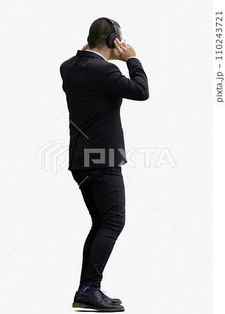 man in full growth. isolated on white background wearing headphones dancing 110243721