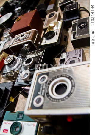 Eclectic Assortment of Vintage Cameras from Elevated Diagonal Perspective 110244144