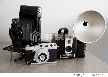 Evolution of Vintage Cameras on Neutral Background Evolution of Vintage Cameras on Neutral Background 110244237