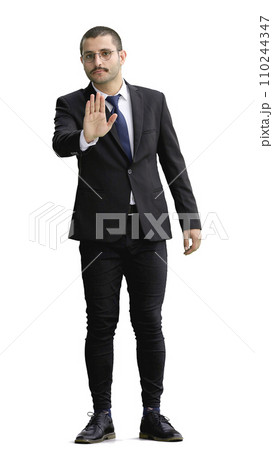 young man in full growth. isolated on white background shows stop sign with hand 110244347