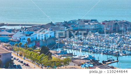 Plaza de California aerial boats docked at Pier 39 with shops and restaurants on the water, San Francisco, CA 110244644