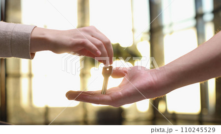 From hand to hand. Close up shot of hand of female seller owner From hand to hand. Close up shot of hand of female seller owner 110245529