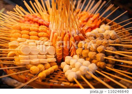 Skewers of streetfood on a table in Thailand,Steamed hot dogs Skewers of streetfood on a table in Thailand,Steamed hot dogs 110246640