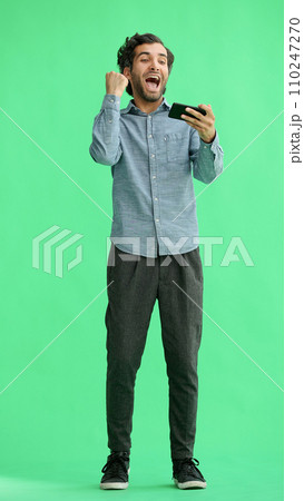 young man in full growth. isolated on green background taking selfie young man in full growth. isolated on green background taking selfie 110247270