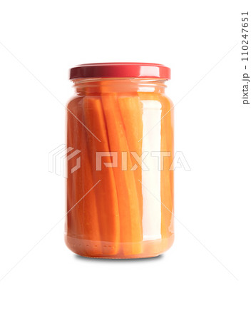 Carrot sticks, homemade fermented carrots, in glass jar with lid. Carrots cut into sticks, fermented by lactic acid bacteria. Unpasteurized and uncooked they provide probiotics and improve digestion. 110247651