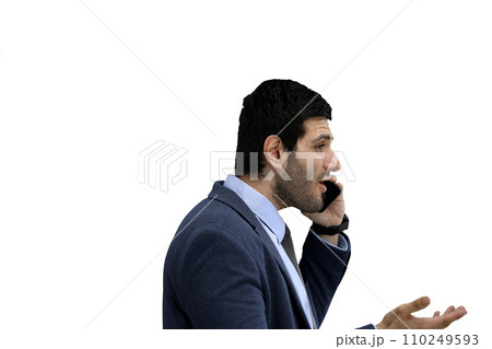 Close-up of a man in an office suit on a White background talking on the phone, in profile Close-up of a man in an office suit on a White background talking on the phone, in profile 110249593