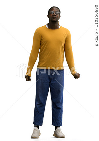 a man in a yellow sweater on a White background looks into the distance a man in a yellow sweater on a White background looks into the distance 110250690