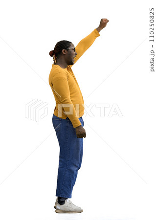 A man in a yellow jacket on White background raised his hand up, in profile A man in a yellow jacket on White background raised his hand up, in profile 110250825