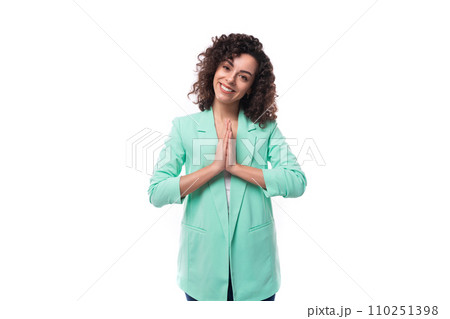 young charming curly brunette assistant woman dressed in an office blue jacket on a white background young charming curly brunette assistant woman dressed in an office blue jacket on a white background 110251398