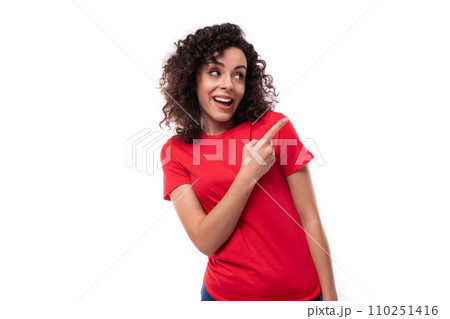 portrait of a 30 year old woman dressed in a red basic t-shirt on a white background with copy space 110251416