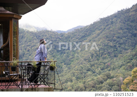 digital nomad concept asian freelancer woman relax and outdoor work at mountain view of coffeeshop 110251523