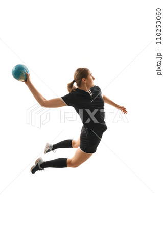 Fit, young, competitive female handball player demonstrating throwing techniques against white studio background. Concept of championship 2024. 110253060