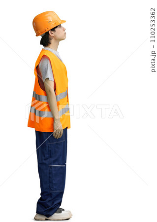 The guy is a builder, on a white background, in full height 110253362